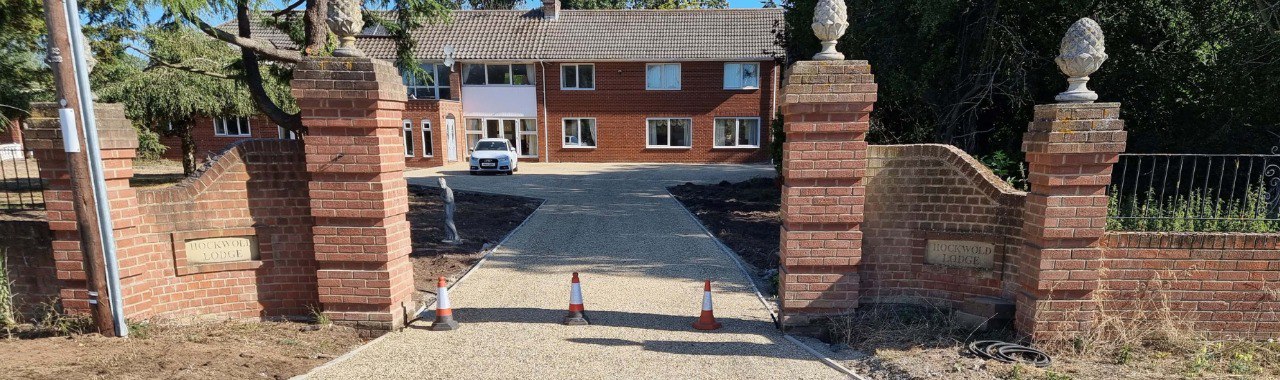 This is a photo of a newly installed chip and tar driveway, installed by Flitwick Driveways